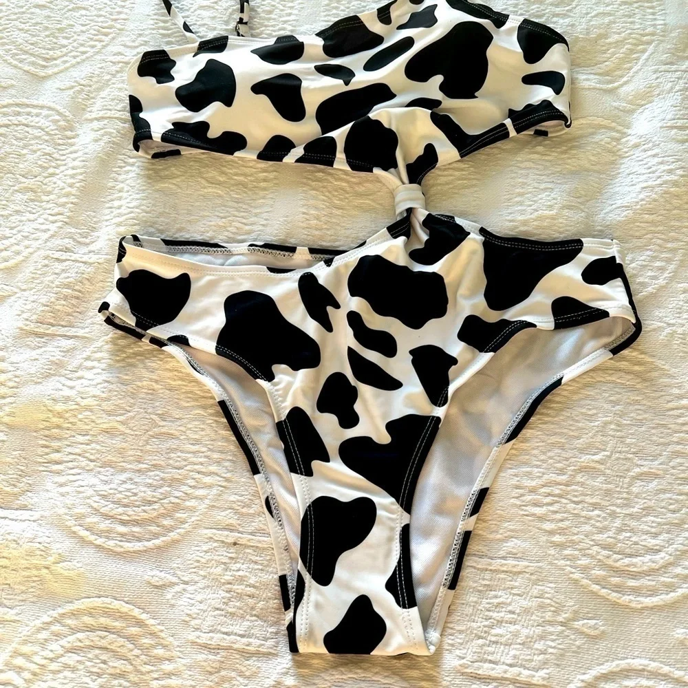 NWOT Black and white asymmetric swimsuit size L.